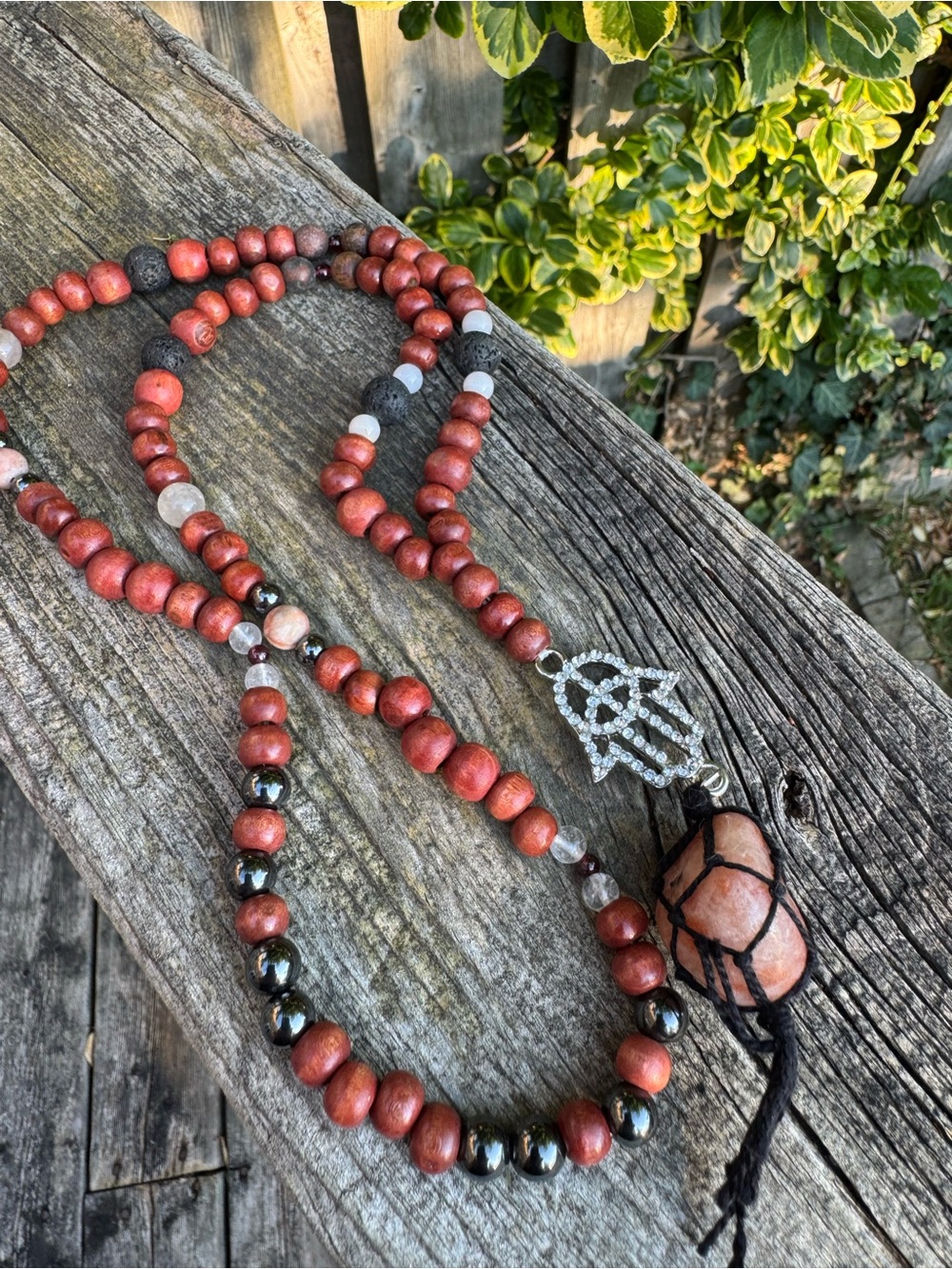 Red Wood Bead Mala Necklace with Lava Rock and Pink Stone Hamsa Hand Pendant